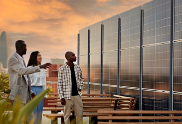 People looking at solar panels on roof