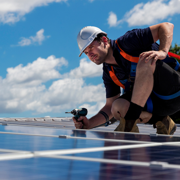 RayCycle employee installing solar panels